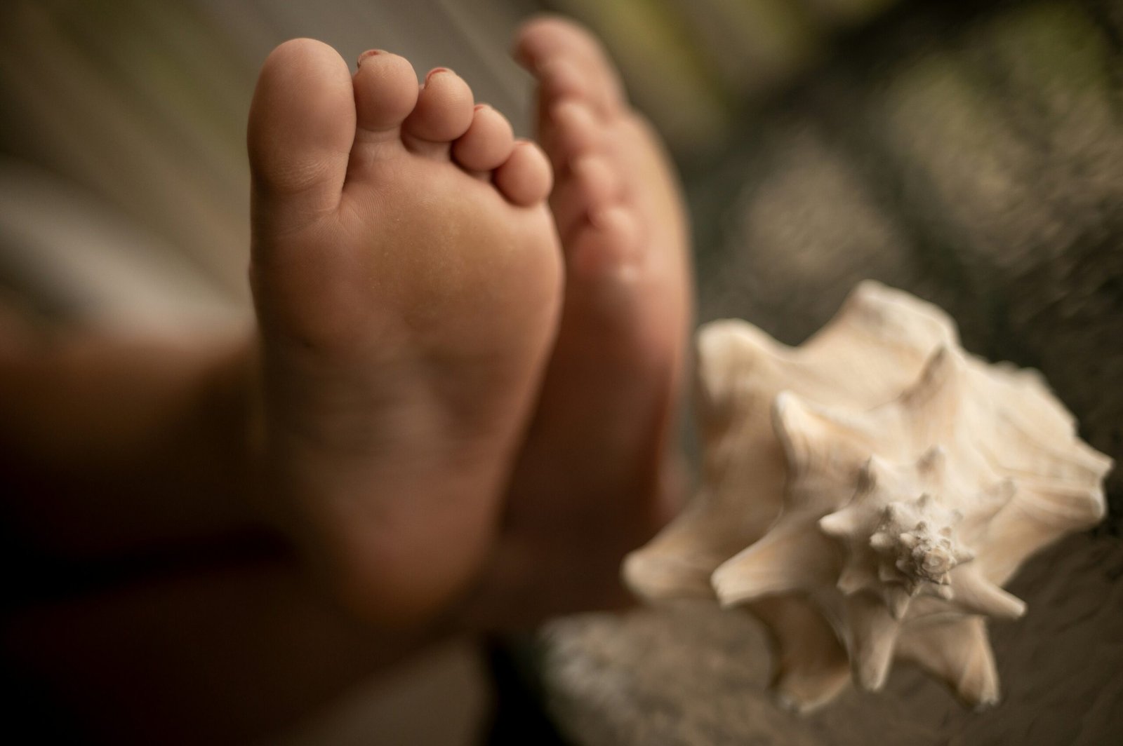 a close up of a person's feet with a starfish